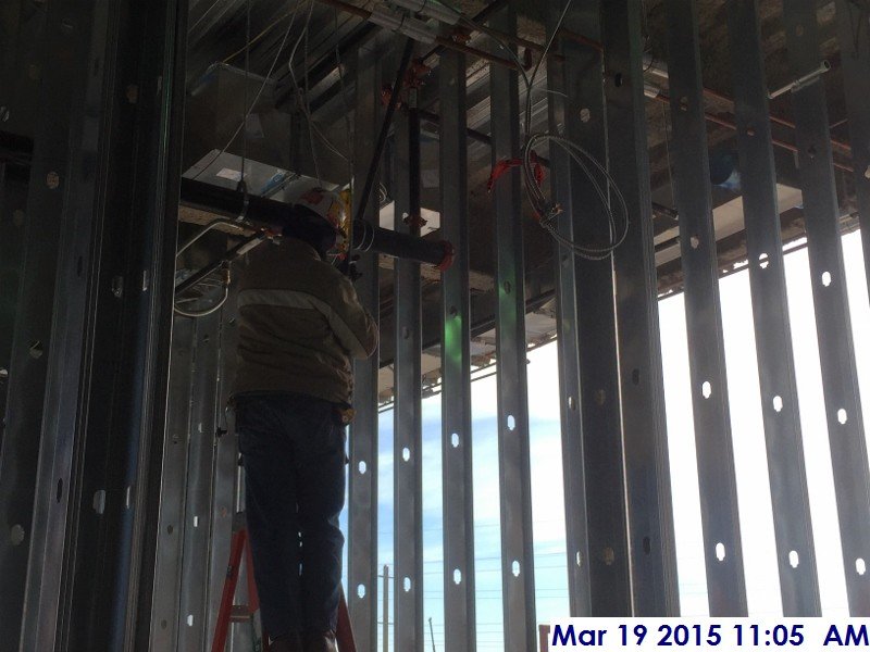 Installing electrical split wire above the ceiling at the 2nd floor Facing East